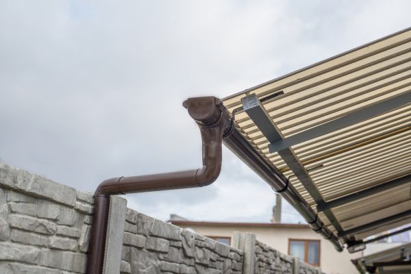 Plastic Downspout Installation in Monument